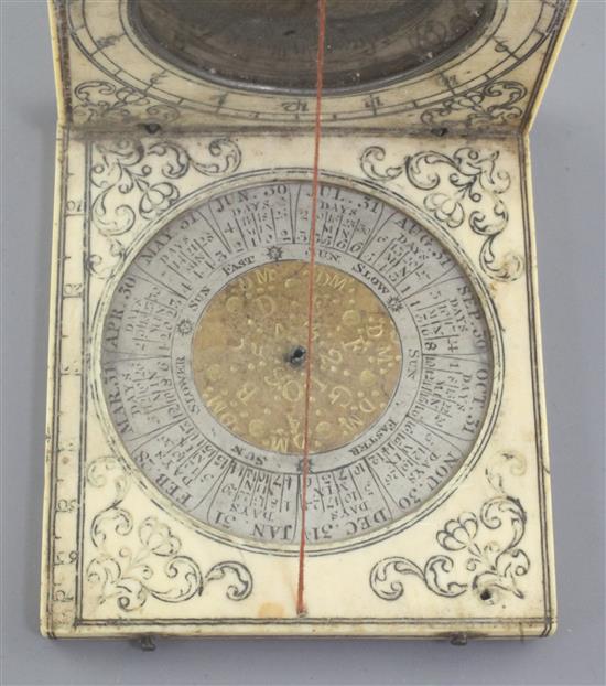 An antique ivory calendar dial